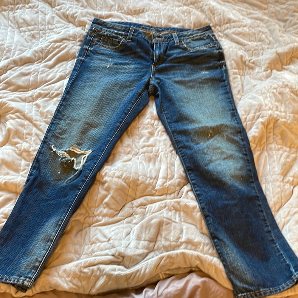 Micheal Kors women’s boyfriend-fit low-rise jeans, dark-wash denim.  Size US 4.